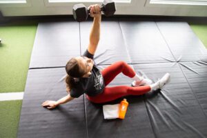 Woman lifting weights at MYo Lab Health & Wellness in Calgary, Alberta