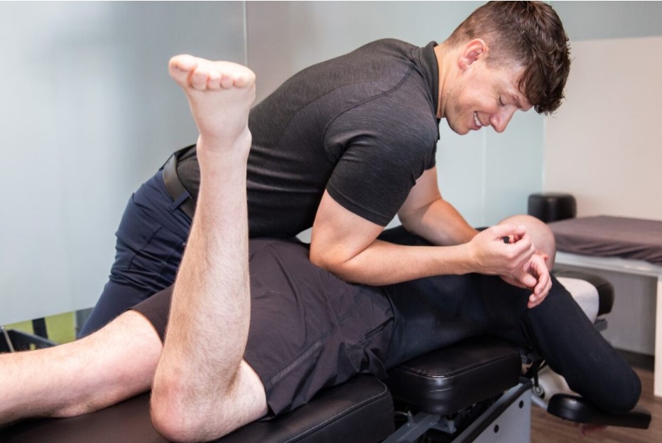 MYo Lab Chiropractor Evan relieving patients hip pain