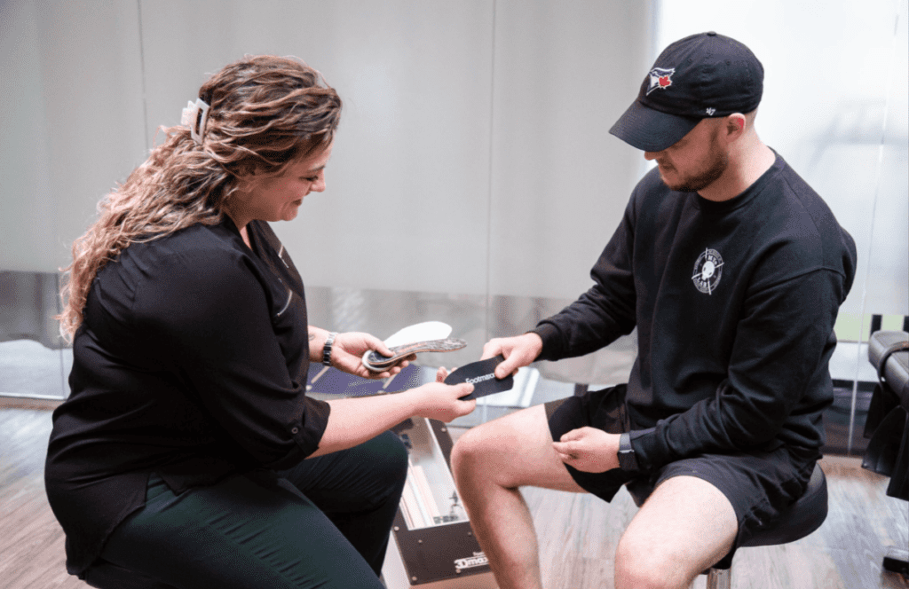 patient testing custom orthotics at MyoLab