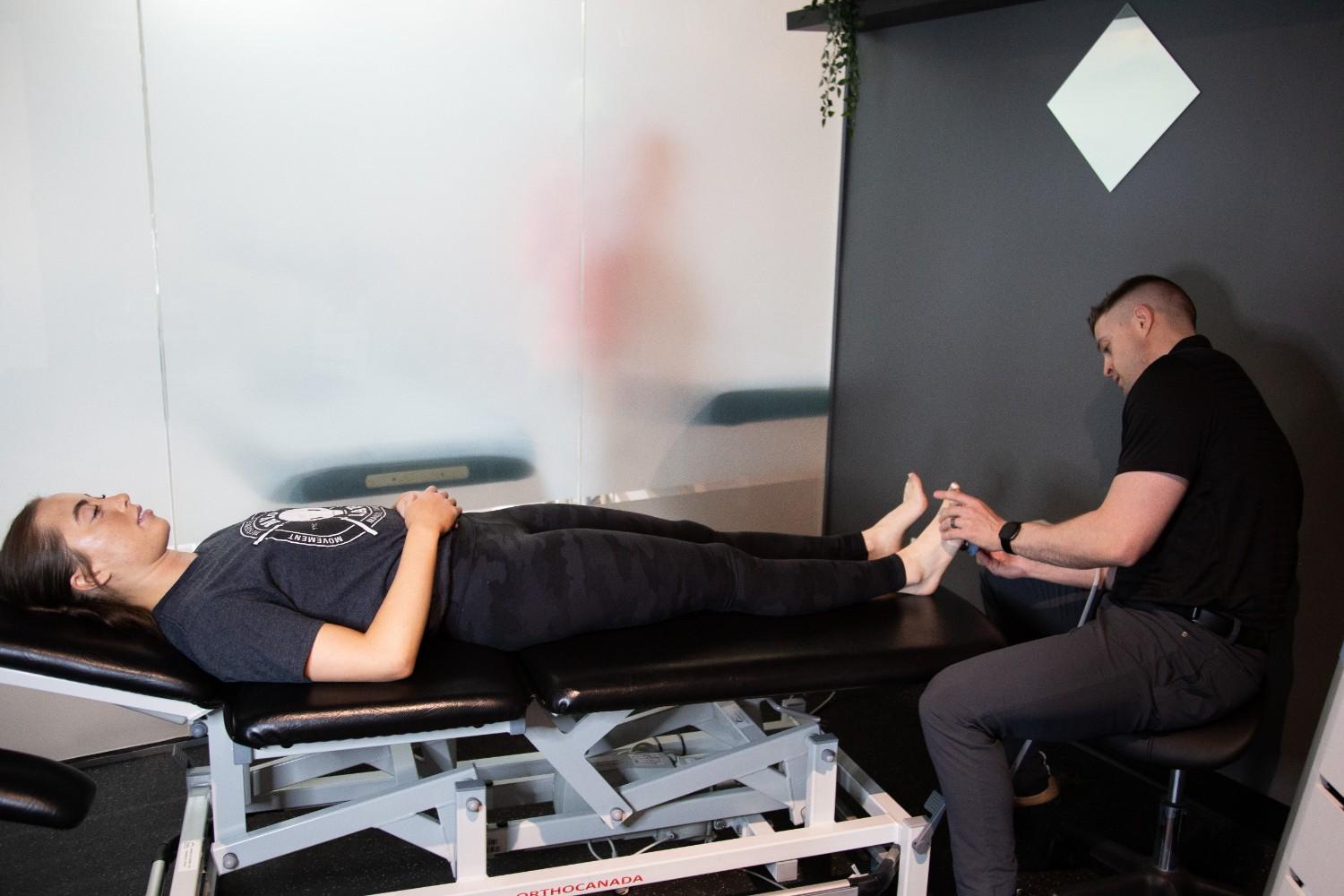 Patient receiving receiving a cold laser therapy assessment at MYo Lab