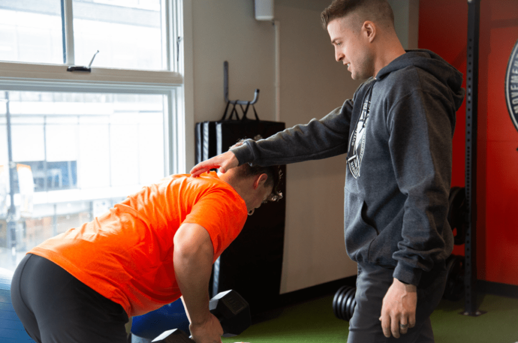 Myo lab expert helping a patient with sports injury pain