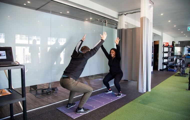 Kinotek system analyzing squat mechanics and functional movement patterns at MYo Lab Health & Wellness.